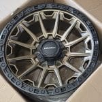 17x9 6x139.7 ET0 110.1 Dark Bronze Black Lip